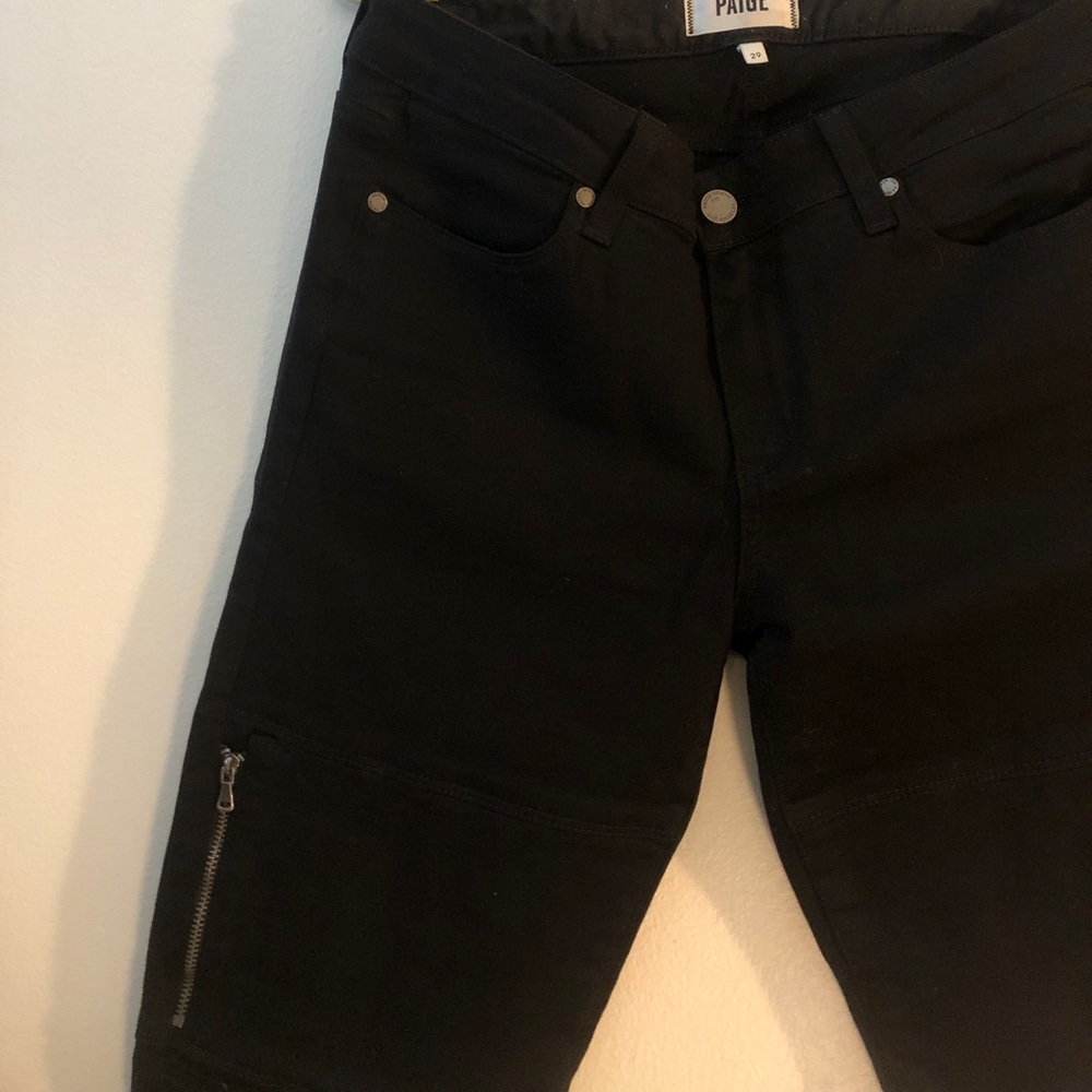 Paige black skinny jeans with Moto detailing.